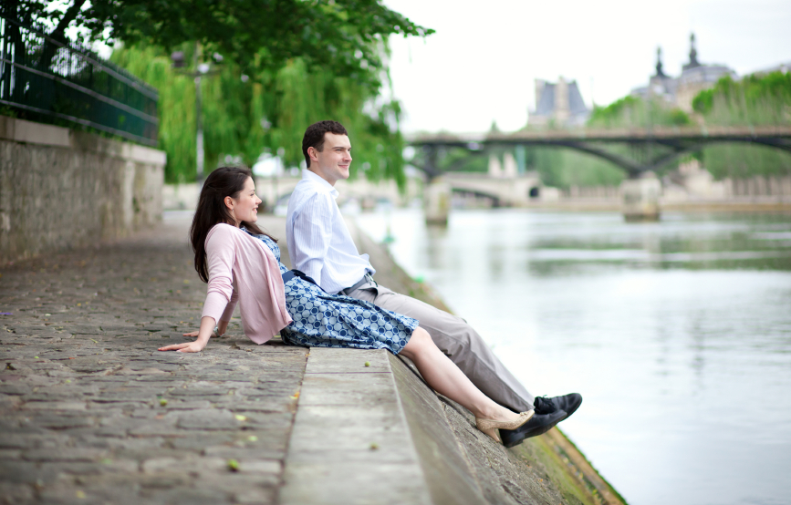 couple is sitting on the embankment
